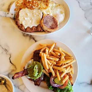 Country fried steak and eggs and  Guacamole, Swiss and Bacon Burger w french fries.