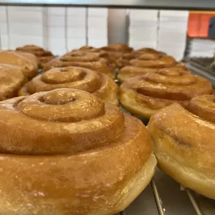 cinnamon rolls on a cooling rack
