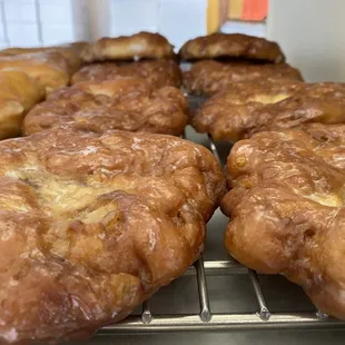 donuts cooling on a cooling rack