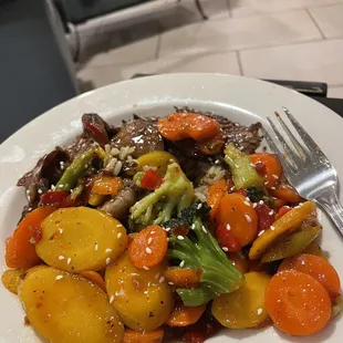 a plate of stir fried vegetables