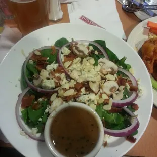 a plate of salad with dressing