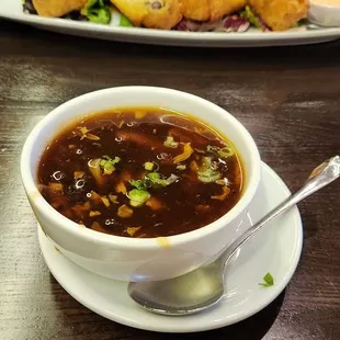 Hot And Sour Soup.  Pretty Good.  Southern Style Egg Rolls In Back.  Mildly Tex-Mex Flavors.