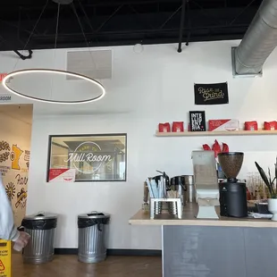 a woman standing in a coffee shop