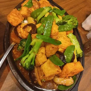 a skillet of stir fried vegetables