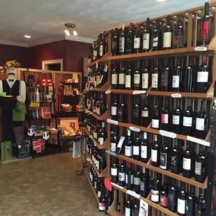 a man standing in a wine shop