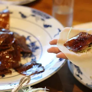 Peking Roast Duck 北京片皮鴨 ($69.95) includes 24 pancakes, plum sauce and scallions