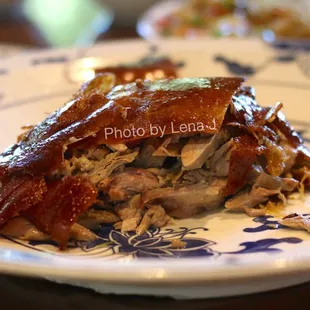 Peking Roast Duck 北京片皮鴨 ($69.95) includes 24 pancakes, plum sauce and scallions