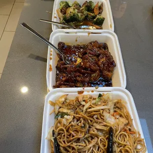 From top to bottom, BBQ pork fried rice, broccoli beef, orange chicken, chicken chow mean. This is after 4 adults dished up.