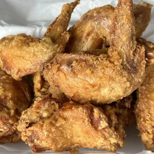 a pile of fried chicken wings