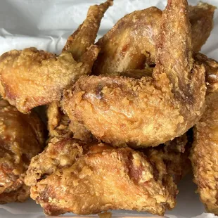 a pile of fried chicken wings