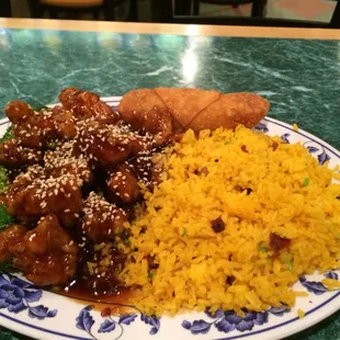 Sesame chicken and fried rice with a awesomely delicious egg roll