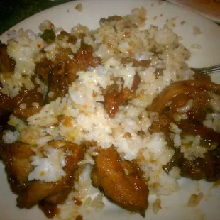 a plate of rice and meat