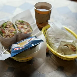 two burritos and a cup of coffee