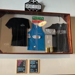 t - shirts hanging on a wall