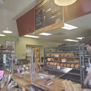 a bakery counter with bread and pastries