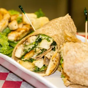 NEW- Chicken Caesar wrap or salad. House made dressing and croutons with romaine lettuce and shredded parmesan cheese.