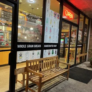 a bench in front of the store