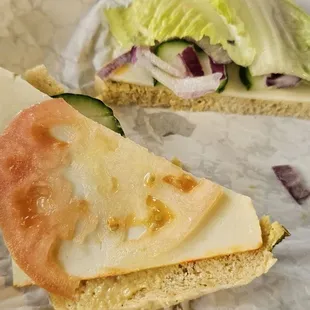a sandwich with cheese and lettuce
