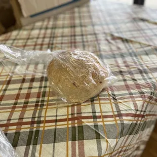 a loaf of bread wrapped in plastic