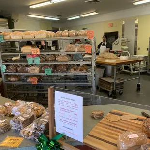 Rack of Fresh bread with oven in background