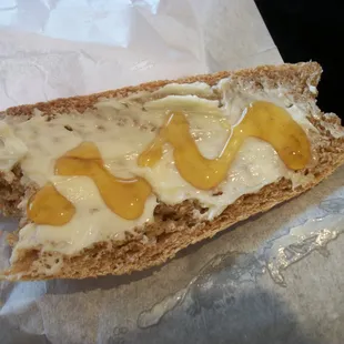 my first slice of Honey whole wheat bread with copious amounts of real butter and local honey