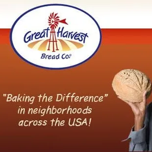 a man holding a loaf of bread