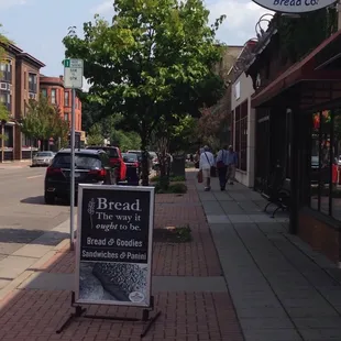 a sign on the sidewalk