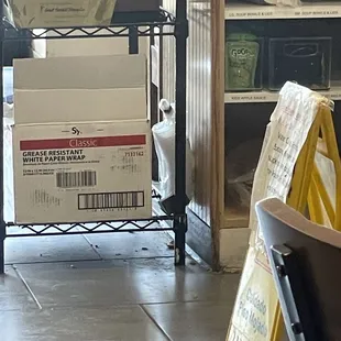 Food waist in the floor by the sandwich prep station