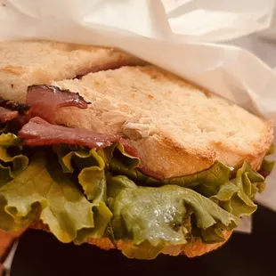 a sandwich with lettuce and ham