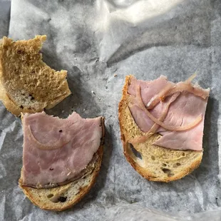 Very sad and barely filled half of a Cubano sandwich on sourdough ($10.25) ordered without pickles but with everything else.