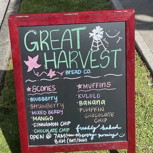 a chalkboard sign on a sidewalk