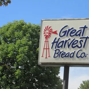 the sign beside the road for the store