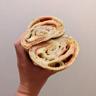 Look at the layers of pepperoni and cheese in this roll.