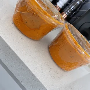 two cups of soup on a counter