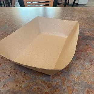 This is the tray that&apos;s suppose to hold my box of food. Let me just walk around with this and hope my food don&apos;t fall smfh.