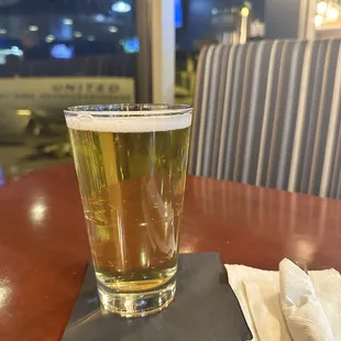 a glass of beer on a table