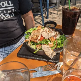 A half garden salad with chicken added.