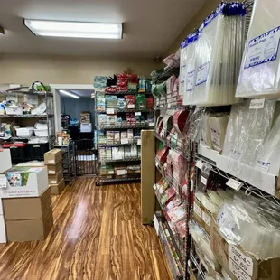 Clearance rack located against back wall near office door.