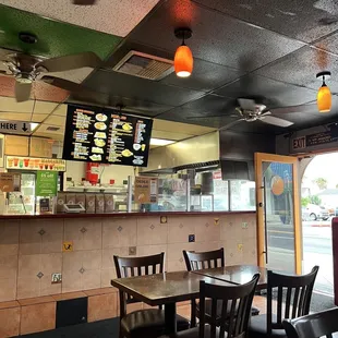 I love when a cook's work station is facing outward with a big window. Such a vibe