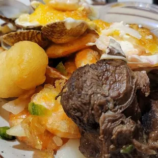 a plate of meat and potatoes