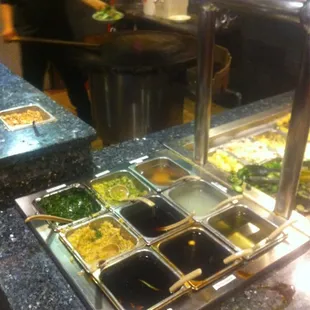 Sauce station at the Mongolian grill