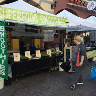 people shopping at a farmers market
