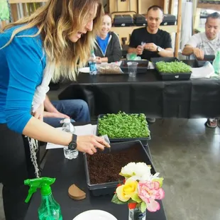 a woman tending to plants