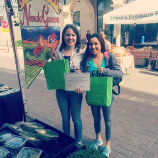 two women holding their certificates