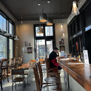 a woman sitting at a bar