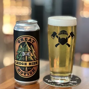 a glass of beer and a can of beer