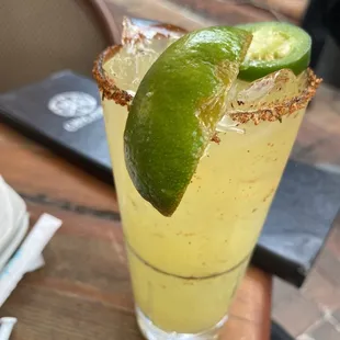 a margarita with lime garnish