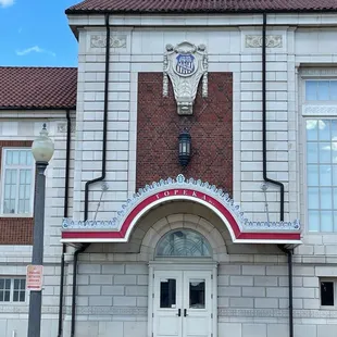 THAT "unimpressive" door under all THAT impressive architectural adornment! Perhaps the original doors befitted their surroundings.