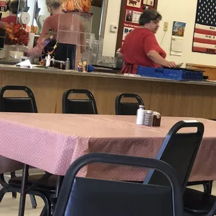 a woman preparing food in the kitchen