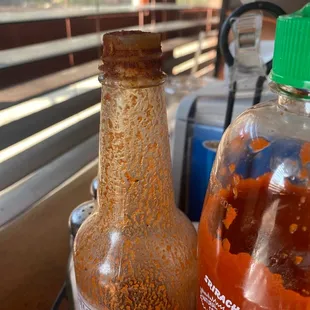 a bottle of hot sauce and a bottle of hot sauce